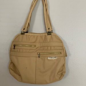 brown stowaway bag